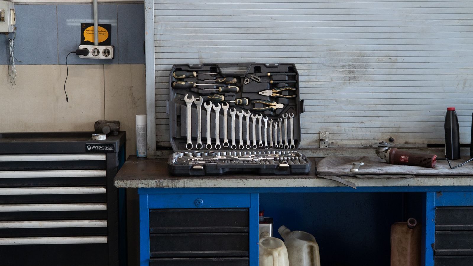 Organized workbench with a tool chest and wall-mounted tools