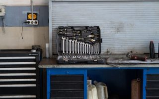 Organized workbench with a tool chest and wall-mounted tools