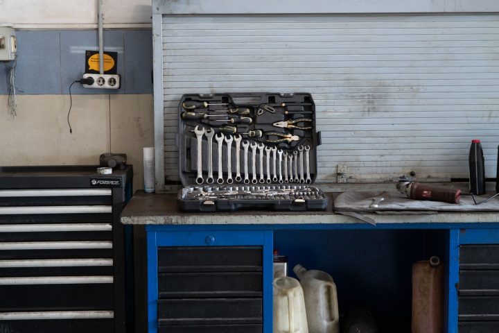 Organized workbench with a tool chest and wall-mounted tools