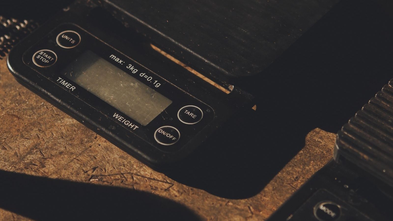 Digital scale on a rustic wooden surface