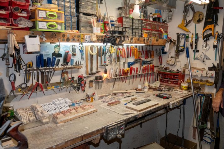 Well-organized workshop with tools and supplies on display